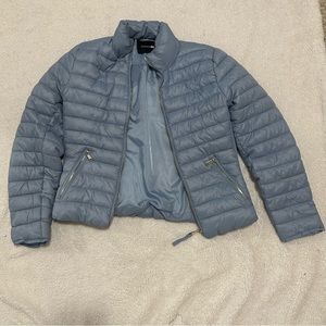 Large light blue puffer jacket
